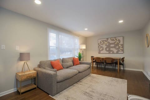 Make yourself at home on our plush sofa and relish in the soothing atmosphere of the elegantly decorated living room.