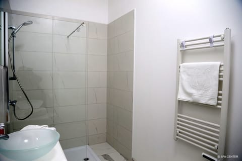 Shower, free toiletries, towels, soap