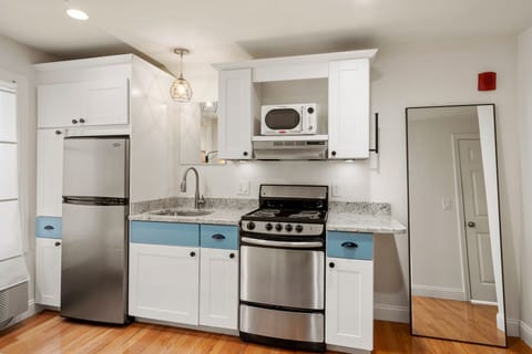 Kitchen with essentials. Glassware, utensils, baking sheets, cutting boards, and more. (1)