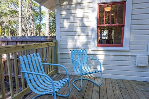 Cozy deck with table for 4 seating, enjoy coffee or wine in private serenity.