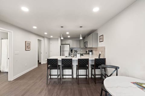 Sleek, fully stocked kitchen with high-end appliances—perfect for home-cooked meals or morning coffee.