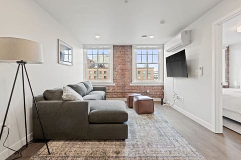 Relax in style—cozy seating with curated art and design accents.