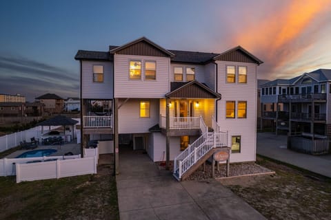 Golden skies, coastal charm, and your perfect OBX getaway await at SEA-esta—a warm and inviting beach retreat designed for rest, fun, and unforgettable family memories.