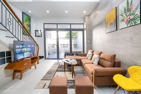Living room with a smart TV, big soft sofa