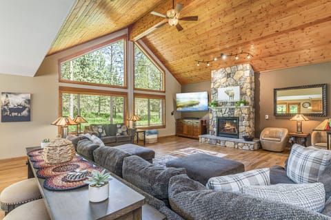 Massive Picture Windows look out on Towering Pines from the Great Room