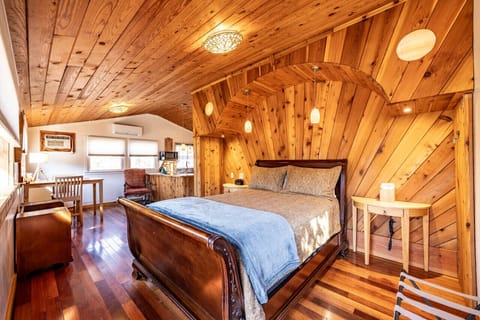 The bedroom in the cottage with beautiful woodwork.