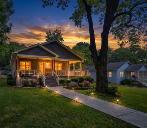 Experience Atlanta evenings on the welcoming porch amidst lush landscaping!