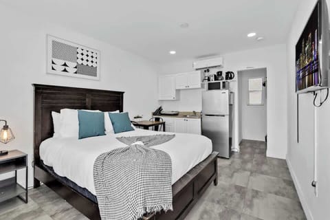 Unwind in this cozy studio with plush bedding, a sleek kitchenette, and modern comforts—perfect for short stays, solo travelers, or couples seeking a stylish vacation rental near the beach.

