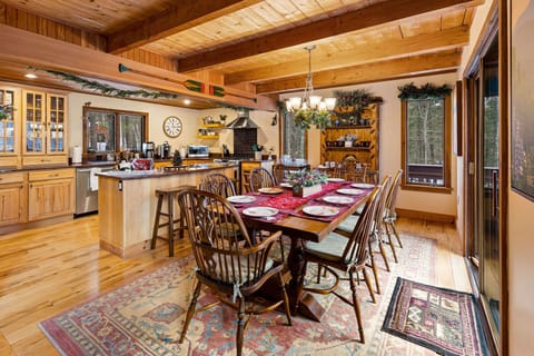 Dinning room with sliding glass doors that lead to huge wrap around deck