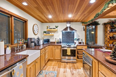 Chef quality kitchen with custom cabinetry, granite counter tops,farm style sink