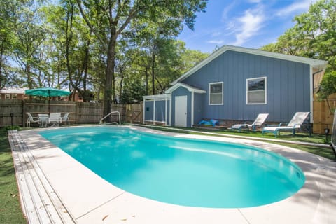 Welcome to Blue Moon Beach Cottage! Enjoy your own private pool with lounge chairs for relaxing and soaking up the sun.