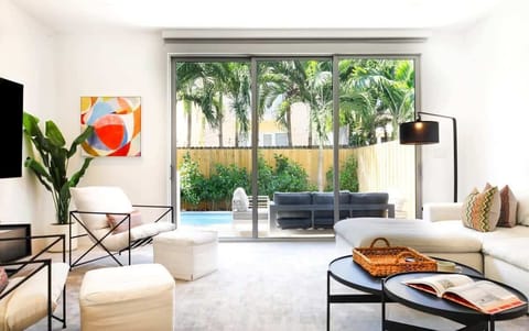 Embrace the warmth of our living room cocoon, where the softness of the sofa invites you to unwind and enjoy the simple pleasures of life.