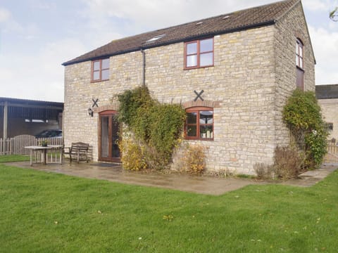 Stone built holiday home with paved patio | The Creamery, North Wootton, near Wells