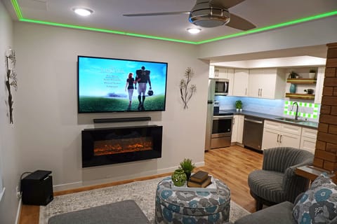 60" Smart TV with Soundbar, Subwoofer and Fireplace, LED designer lighting