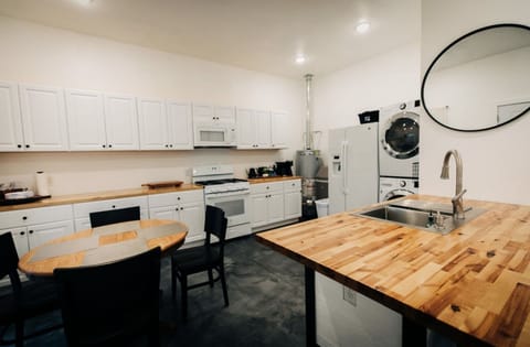 Spacious kitchen fully stocked.