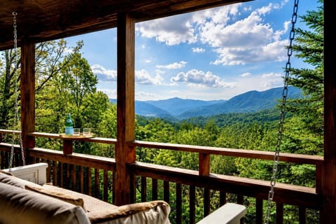 The Smokies stretch out in blue-stacked ridges from your upper deck. This is the view that quiets the kids.