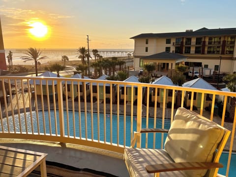RELAX IN OUR COMFY PADDED CHAIRS AND ENJOY THE VIEW OF THE POOL AND SUNSET!
