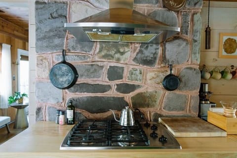 The back of the stone fireplace adds special detail to the kitchen