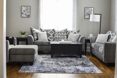 Living room with two couches and an oversized chair perfect for a comfy day in!