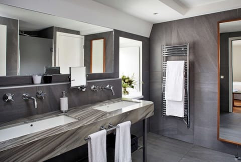 Combined shower/tub, eco-friendly toiletries, hair dryer, bathrobes