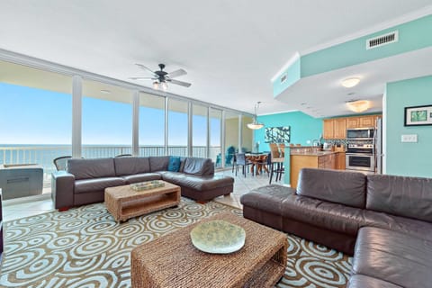 The seamless transition to the outdoor balcony enhances the sense of light and openness.