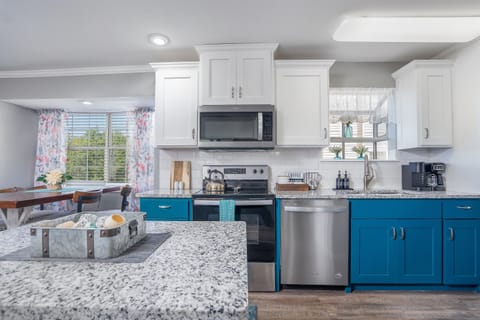 Whip up a delicious meal in the fully equipped kitchen - the heart of your cozy condo that's sure to inspire your inner chef!