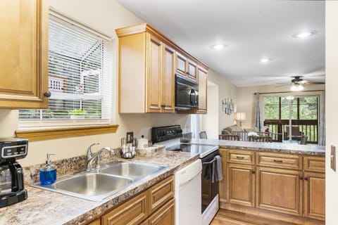 Whip up a delicious meal in the fully equipped kitchen - the heart of your cozy condo that's sure to inspire your inner chef!