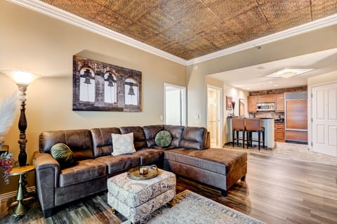 Luxurious living room with custom tin ceiling.