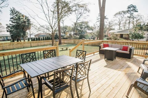 Multiple seating options make this deck a space where your whole group can hang out and enjoy the views of Lake Marion.