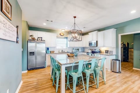 Well equipped kitchen with a huge island. Perfect for family gatherings!