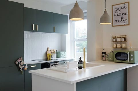 Enjoy cooking in our  sleek white counter serves as the perfect canvas for homecooked meals