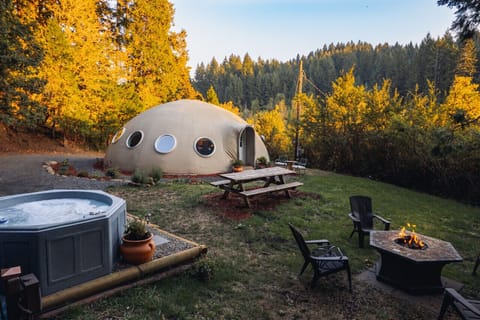 Hot tub, fire ring, picnic table, and beautiful nature setting.