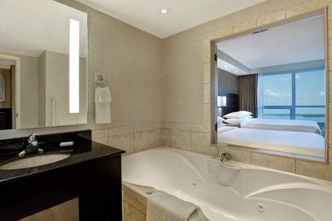 2 Queen Beds with Sofa Bed, Whirlpool and partial view of Niagara Falls - Floor 15 | Bathroom | Free toiletries, hair dryer, towels, soap