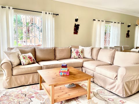 Living room sofa with tan slip covers