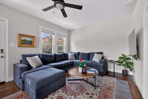 Living Room with Queen Sleeper Sofa + Smart TV