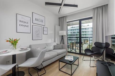 Living room with a comfortable sofa and TV. 