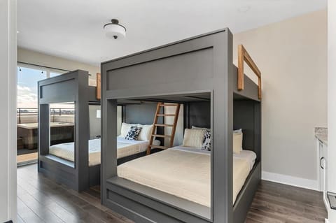 Bedroom 8 - Custom built side by side bunk beds with queen mattresses.
