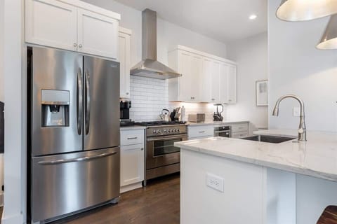 Stainless appliances and all essentials in a stocked kitchen.