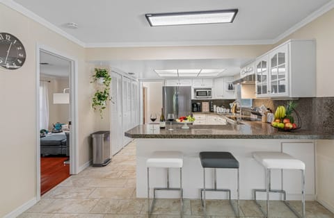 Crisp, clean lines and modern finishes make this kitchen a true showstopper, while still maintaining a warm and welcoming vibe.
