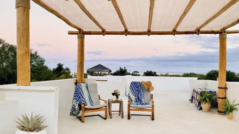 Rooftop patio with views of the sea