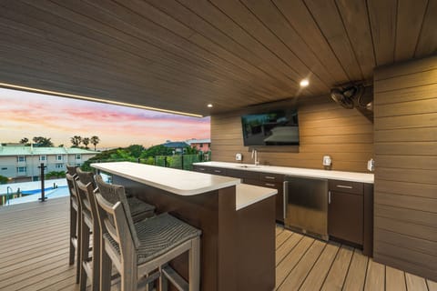 Rooftop bar area with TV for entertainment