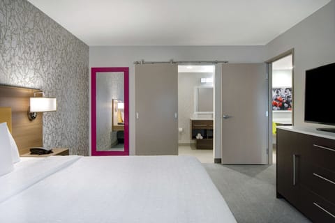 Hypo-allergenic bedding, desk, laptop workspace, blackout drapes