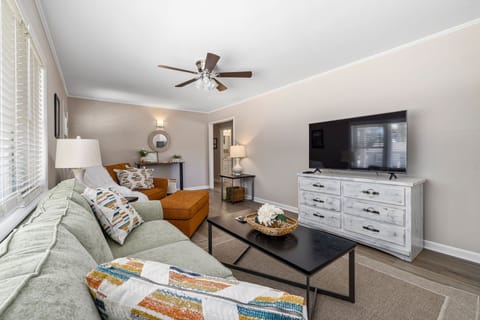 Living room: Couch, oversized chair & ottoman. Smart TV. 