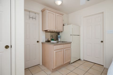 Small Kitchenette area with extra refrigerator located on the ground floor.