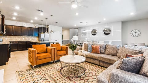 Open-concept living and kitchen area with stylish and cozy design