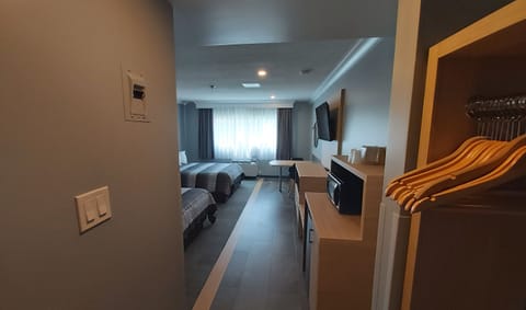 Deluxe Room, 2 Queen Beds, Non Smoking, Includes Waterpark Passes for Four Guests | Desk, blackout drapes, iron/ironing board, free cribs/infant beds