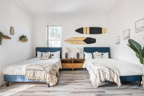 Twin full-sized beds with a Cali-coastal theme.  Perfect for a child's room