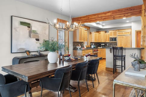 Spacious dining area with a long table.