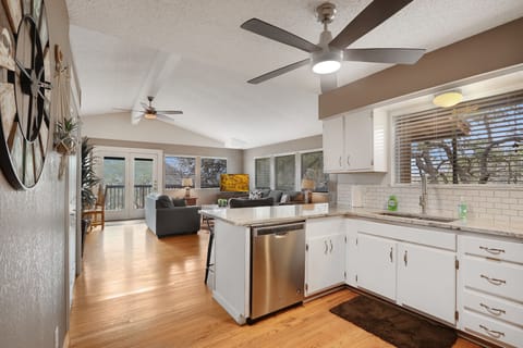 View of the kitchen and living room as you walk toward the rear of the home.