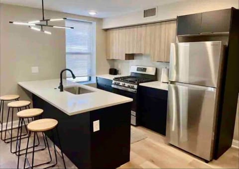 Check out our stunning, brand-new kitchen! It’s spacious and fully loaded with all the amenities you need, plus a breakfast bar and a dining table for meals and hangouts. Perfect for whipping up your favorite dishes or enjoying a nice meal!